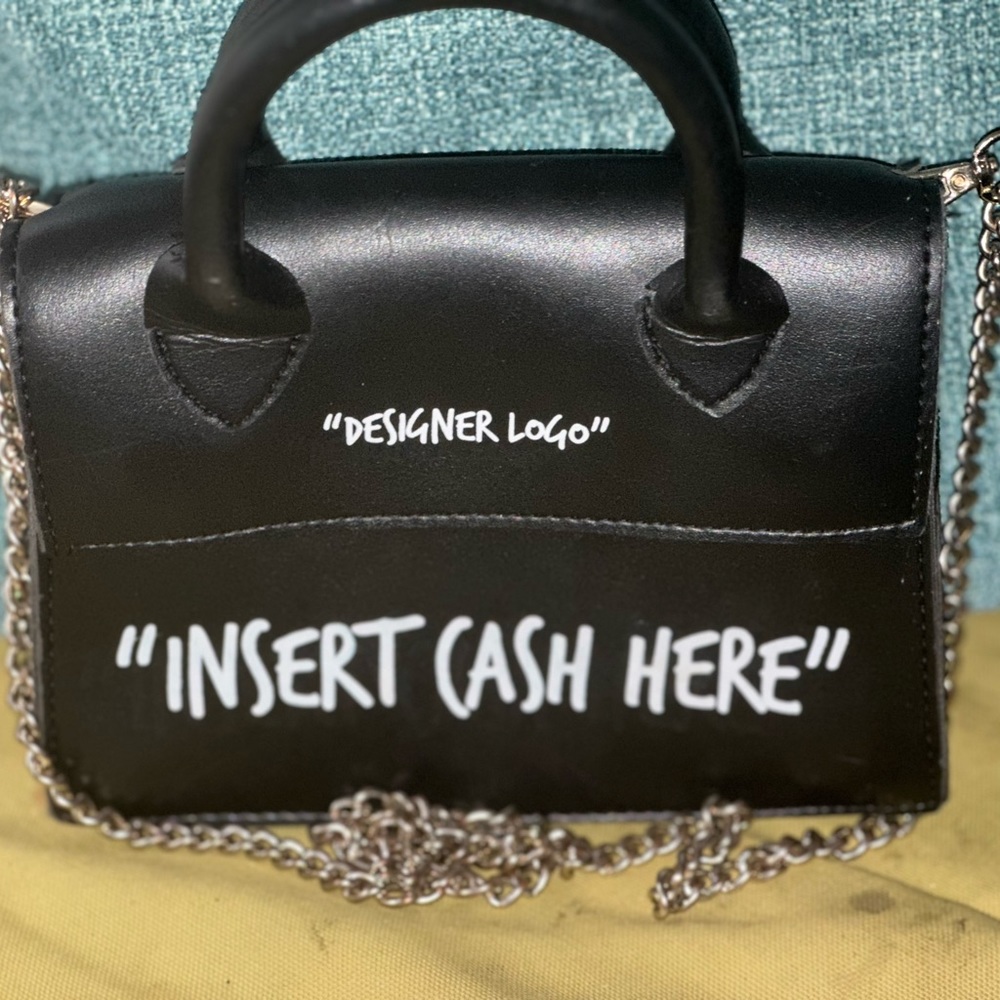 black purse “Insert cash here”